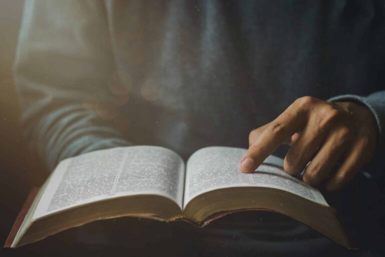 Close up,Of,Christian,Man's,Hands,While,Reading,The,Bible,Outside.sunday